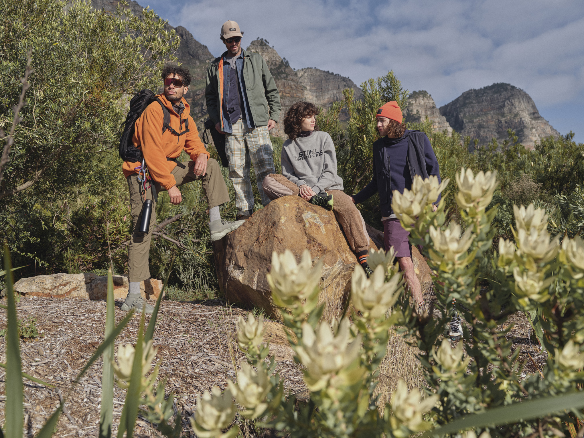 Group of young people in a car and wearing clothes from the STIHL Kogel Bay fan collection