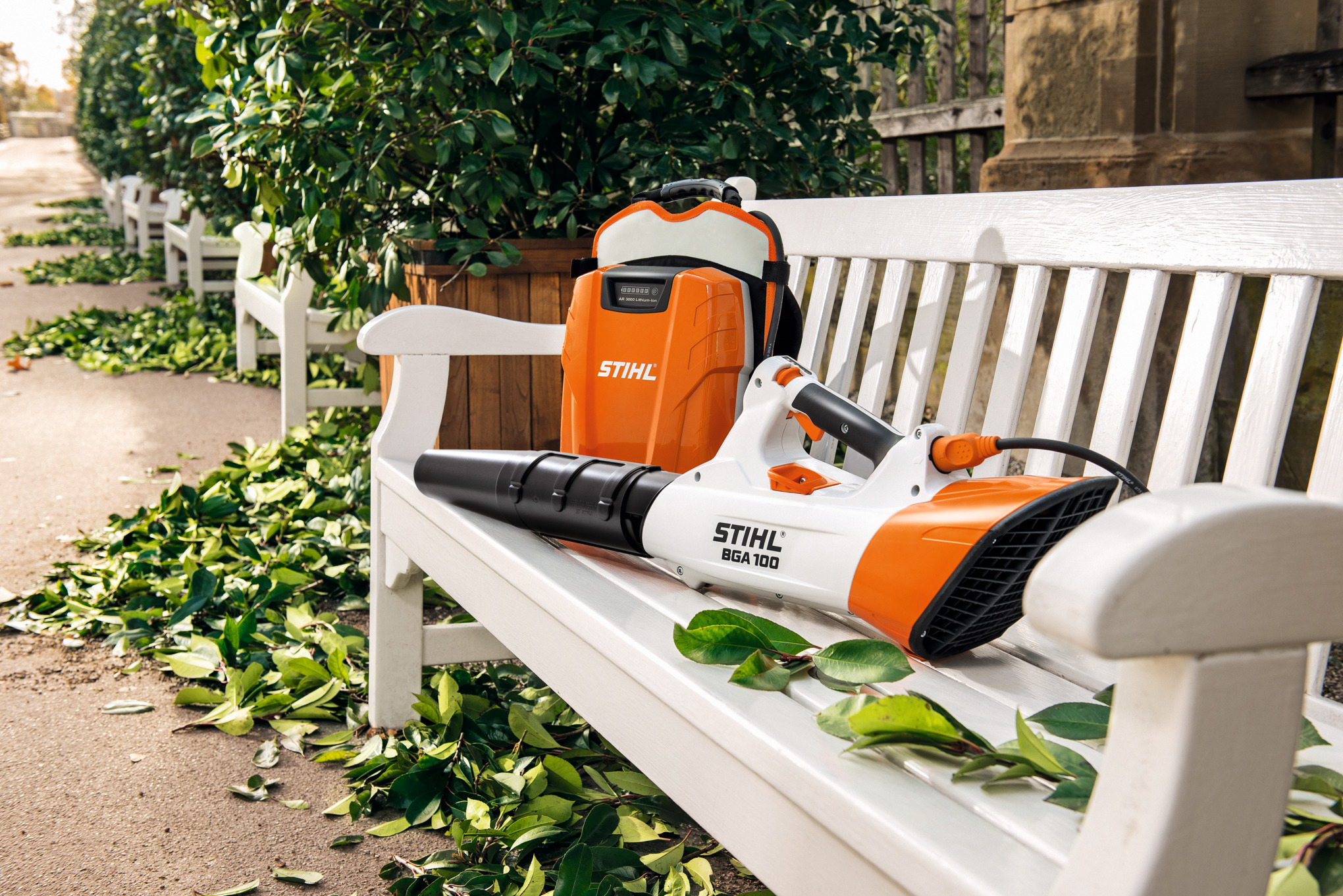 STIHL leaf blower and battery on a white bench